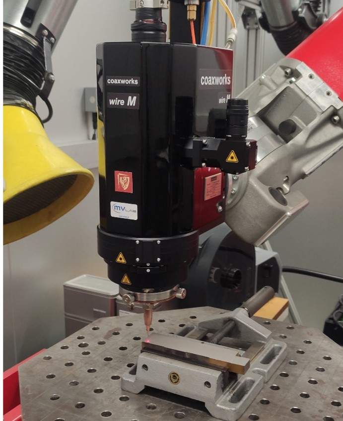 Coaxial laser wire deposition system